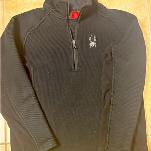 SPYDER Spring Skiing. Black Half-Zip Fleece lined with Spider Logo.Sleek fit